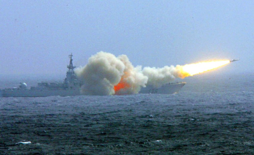 In this photo released by China's Xinhua news agency, a destroyer of the South China Sea Fleet of the Chinese Navy fire a missile during a traning in South China Sea on Saturday, Nov. 17, 2007. Dozen of warships of the South China Sea Fleet were deployed in the competitive training to improve combat capability of the fleet, Xinhua said.  (AP Photo/Xinhua, Zha Chunming)