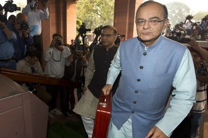 Indian Finance Minister Arun Jaitley arrives at parliament house to present federal budget 2016-17, in New Delhi, India, Monday, Feb. 29, 2016. It was Jaitleys second full budget since Prime Minister Narendra Modi won a huge majority in national election in 2014, on the back of promises to turn around the economy and boost job creation. There have been few sweeping reforms in the past two years that the government has been promising. (AP Photo/Manish Swarup)