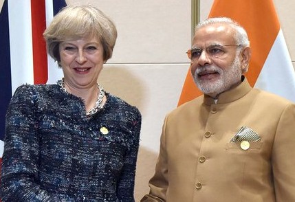 Theresa May to visit India