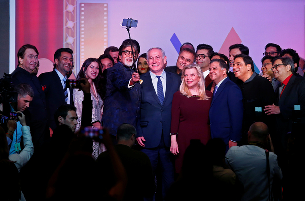 Bollywood actor Amitabh Bachchan takes a photo with Israeli Prime Minister Benjamin Netanyahu, his wife Sara and other Bollywood personalities during "Shalom Bollywood" event in Mumbai. Courtesy: Reuters