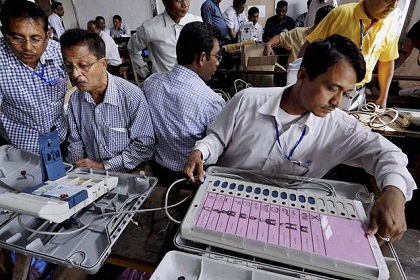 Jorhat :Polling officer checking electronic voting machine (EVM) and documents after collecting from the respective center  on the eve of the 1st phase of Assam State Assembly election 2016 at Jorhat in Assam on Sunday. PTI Photo(PTI4_3_2016_000067A)
