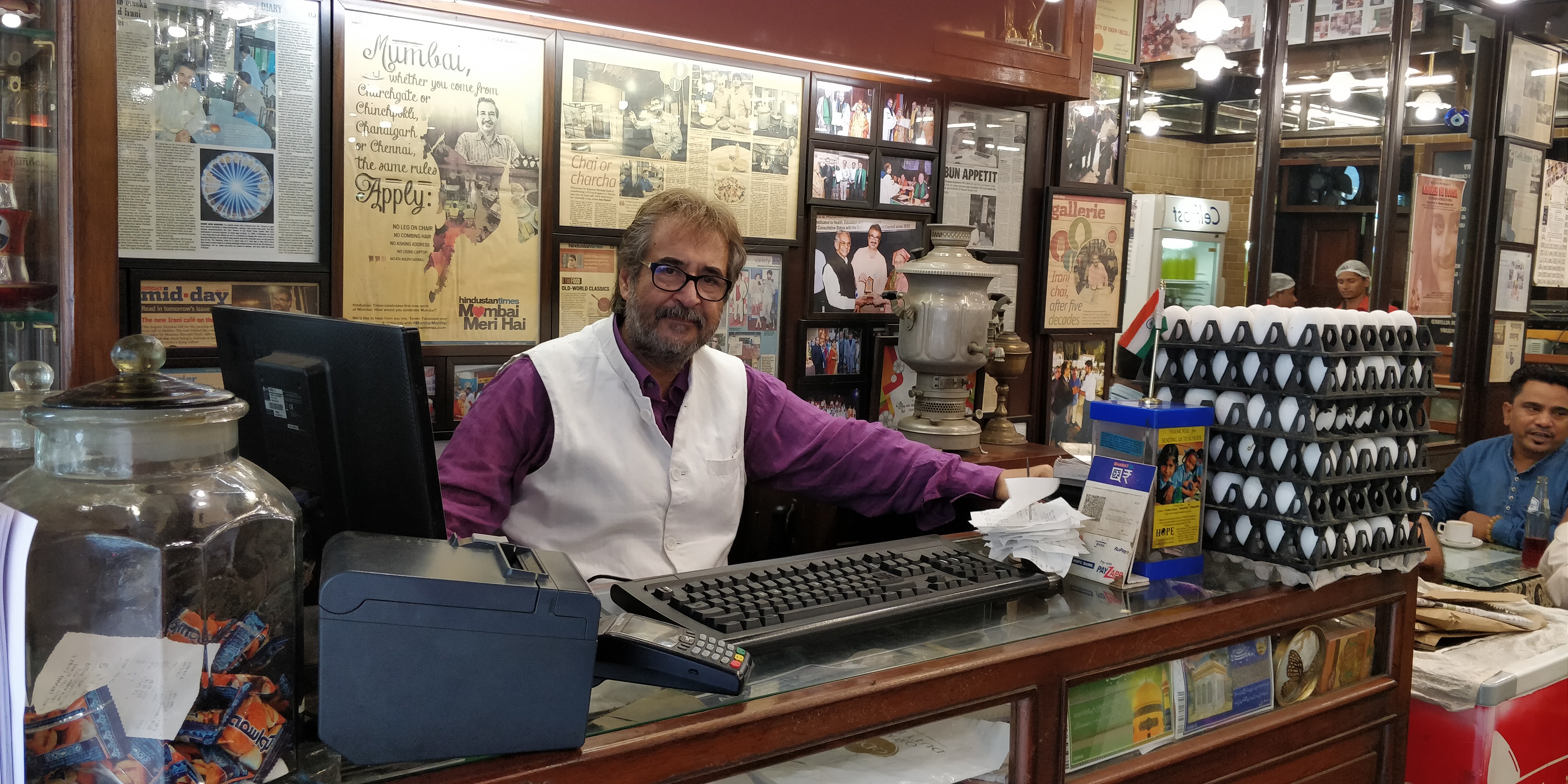 Film-maker Dr Mansoor Showghi Yezdi, at the cash counter of Cafe Irani Chai, which he started five years ago