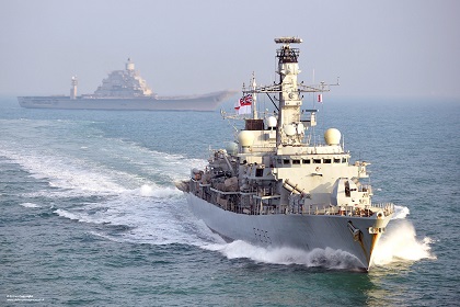 HMS Monmouth is pictured with the Indian aircraft carrier INS Vikramaditya during the vessels transit through the English Channel.

The 4,900 tonne frigate met up with the newest Indian aircraft carrier   weighing in at a massive 45,000 tonnes and helped her safely through the busy English Channel.
 
Originally built for the Russian Navy as a modified Kiev class aircraft carrier, called Baku in 1987, India procured her in 2004 and she was accepted by the Indian Navy in a commissioning ceremony in November 2013.  

Following successful sea trials in July 2013 and aviation trials in September 2013 the carrier began her long journey to her new home of India escorted by auxiliary INS Deepak and Talwar class frigate INS Trikand.


-------------------------------------------------------
© Crown Copyright 2013
Photographer: LA(PHOT) Dean Nixon
Image 45156377.jpg from www.defenceimages.mod.uk
