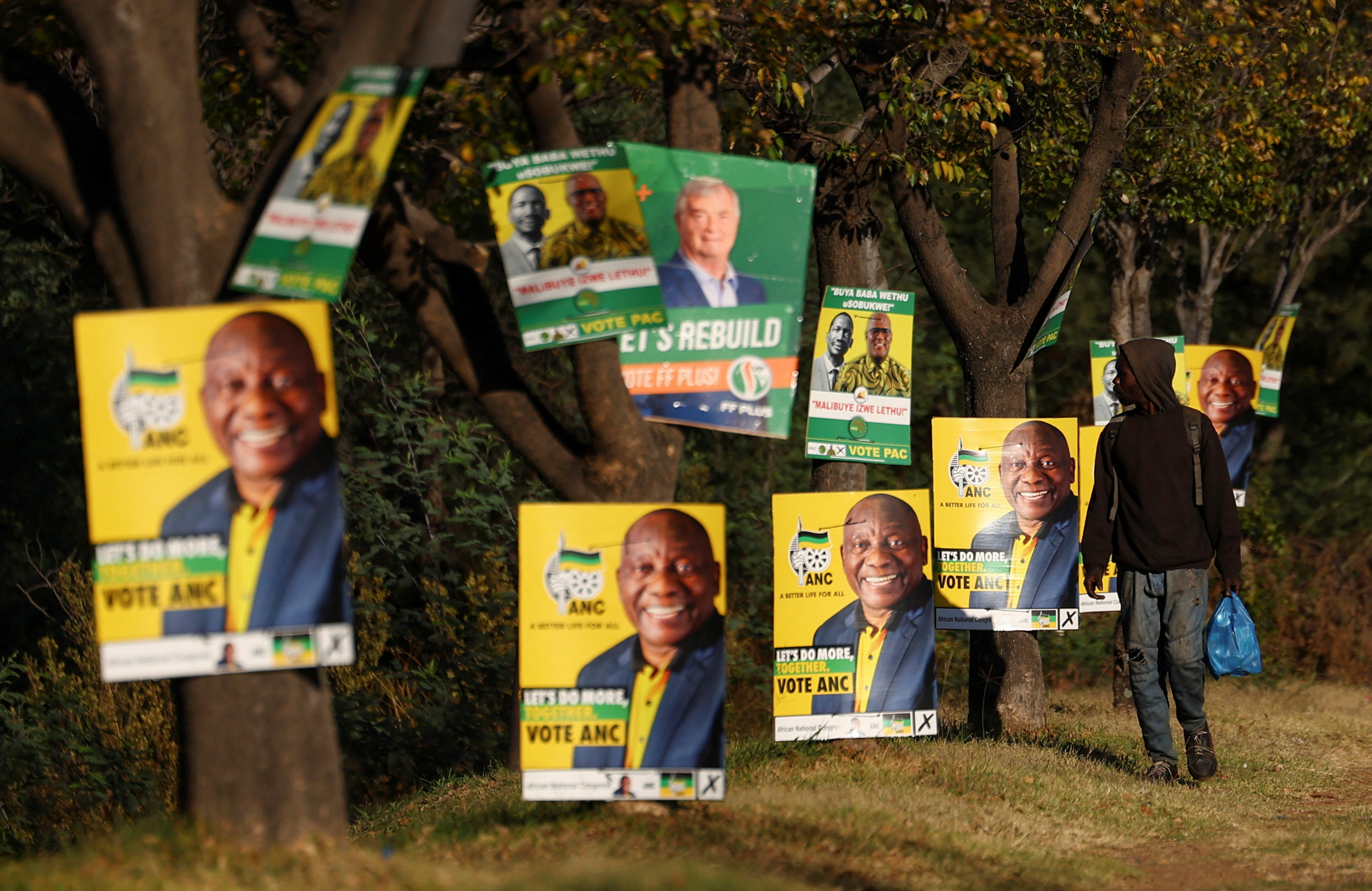 A man walks past election posters of the ruling African National Congress (ANC), as South Africa prepares for the May 29 general elections, in Soweto, South Africa, May 24, 2024. REUTERS/Siphiwe Sibeko