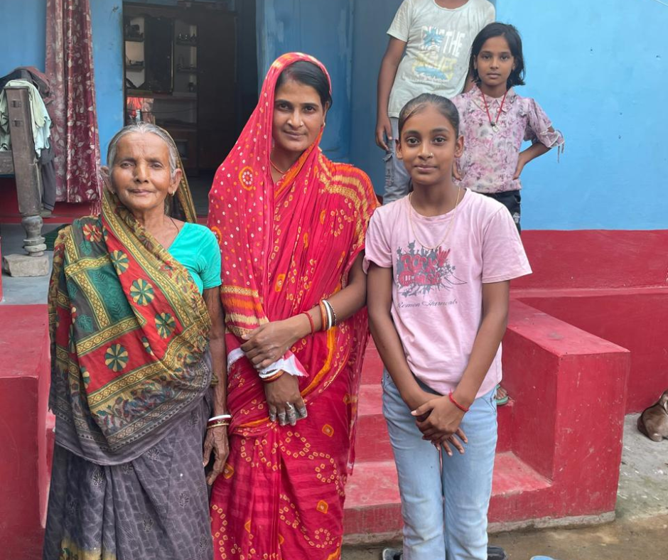 Three generations of women benefitting from government schemes.